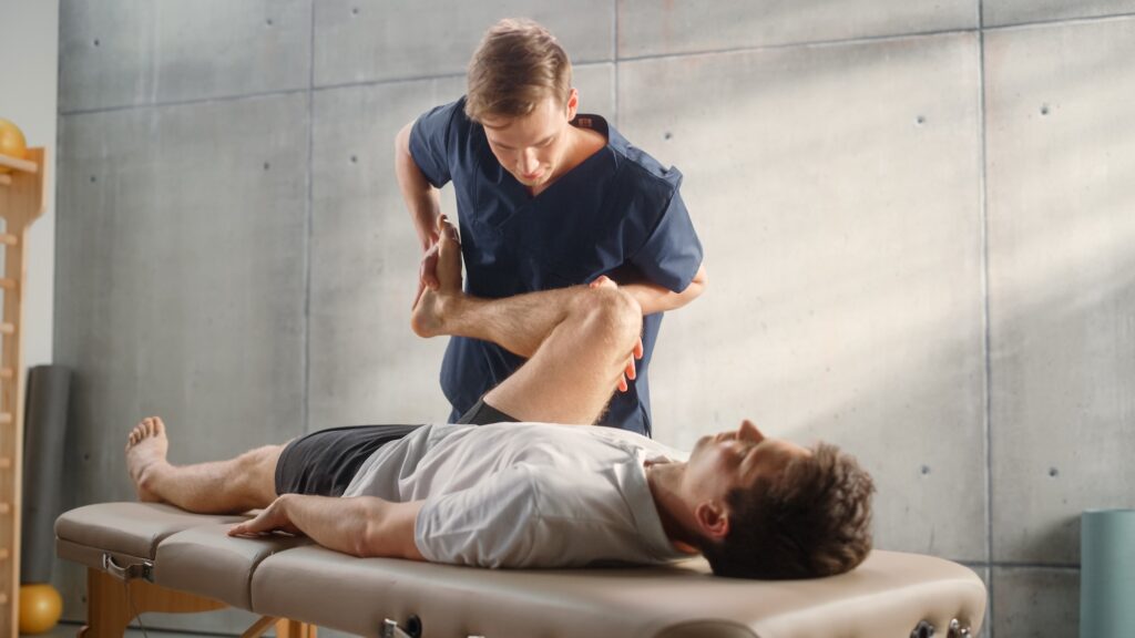 Junior cricketer being examined by a GP — illustrative of the three-way clinical handoff in junior back pain